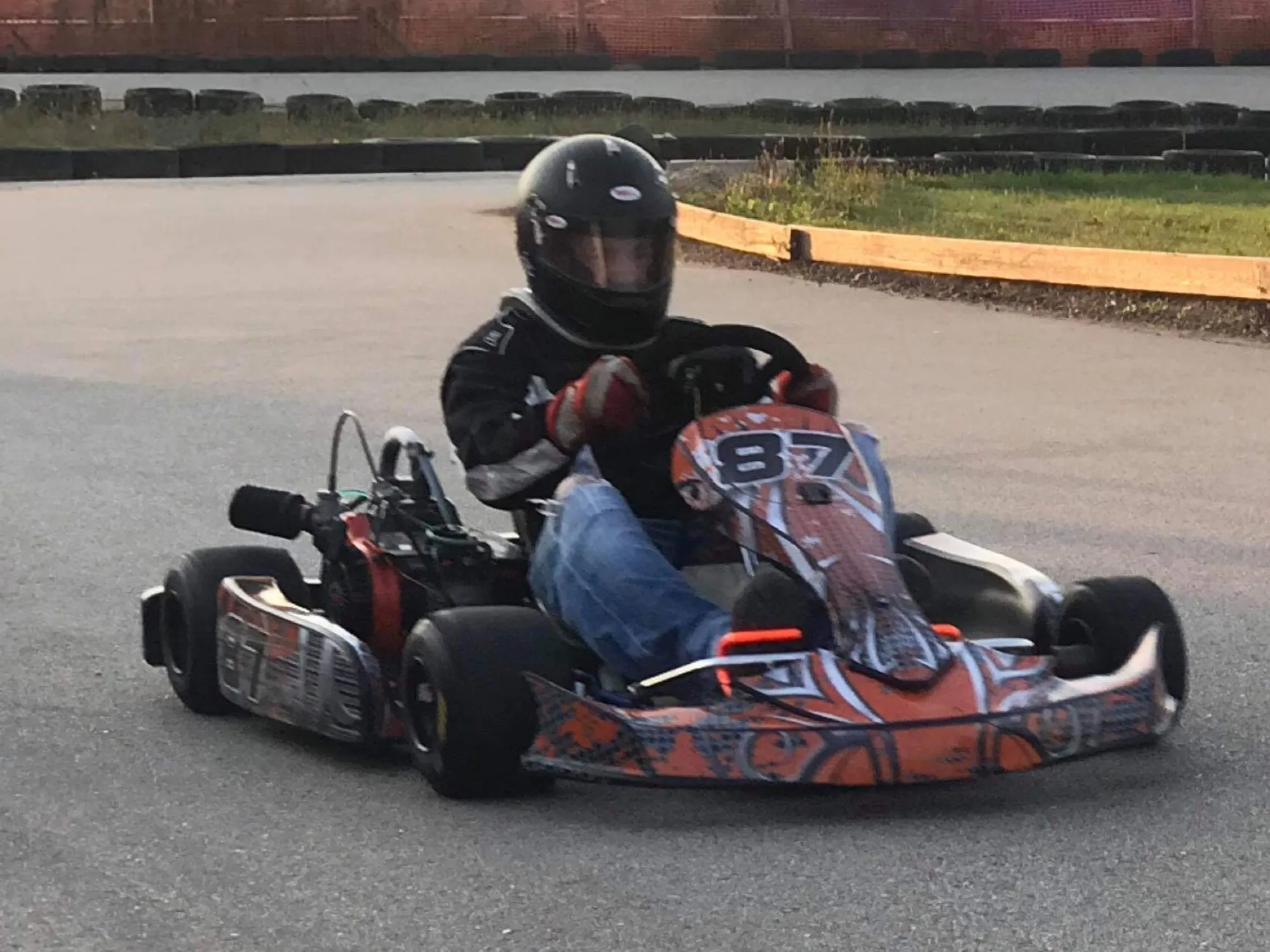 The orange #87S at speed